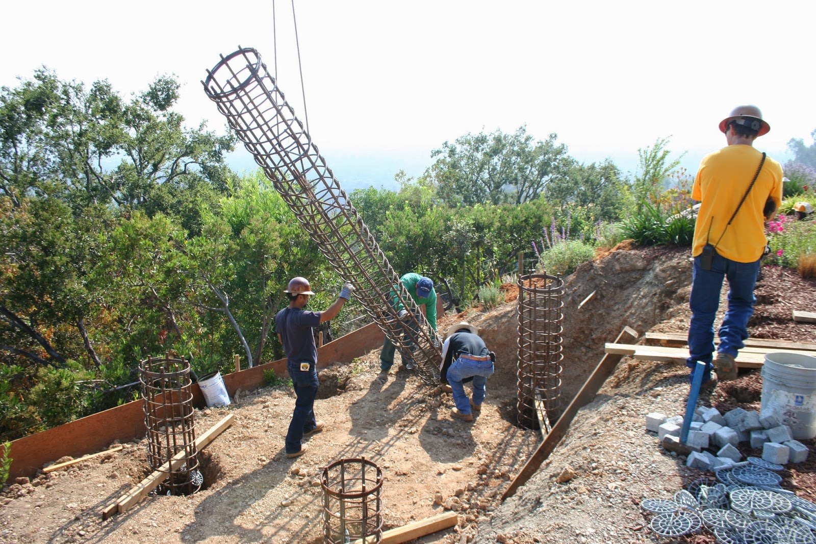 A drilling rig setting caissons on a Los Angeles hillside lot